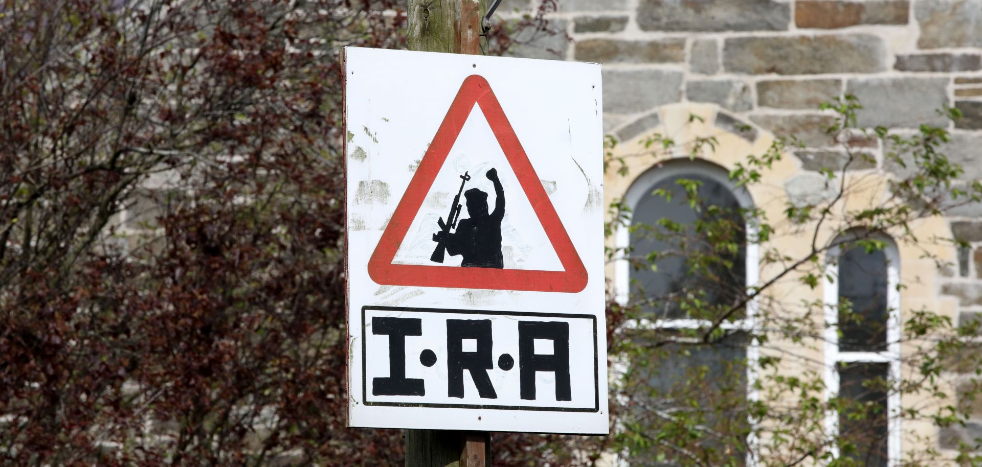 An IRA sniper warning sign on April 20, 2019, overlooking the Bogside area of Londonderry in Northern Ireland.