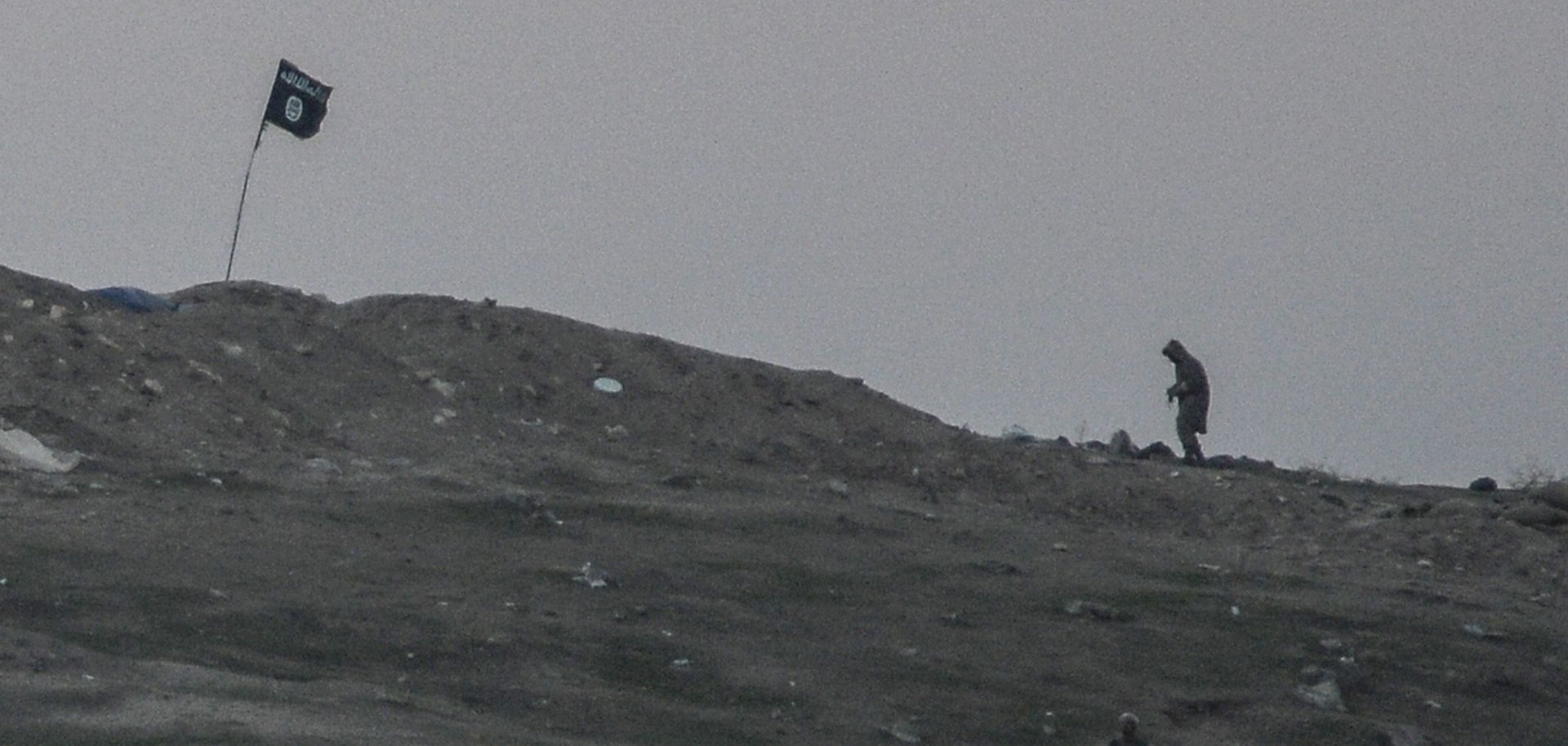 Militants of Islamic State are seen just before the explosion of airstrike on Tilsehir hill near the Turkish border on Oct. 23, 2014, at Yumurtalik village, in Sanliurfa province.