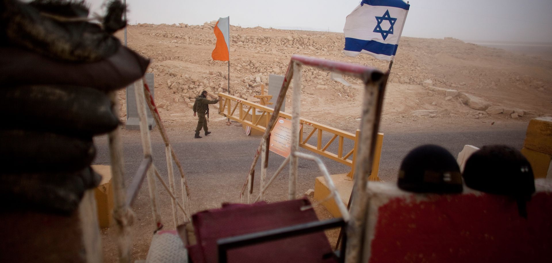 An Israeli soldier patrols a checkpoint at the Israeli Egyptian border.