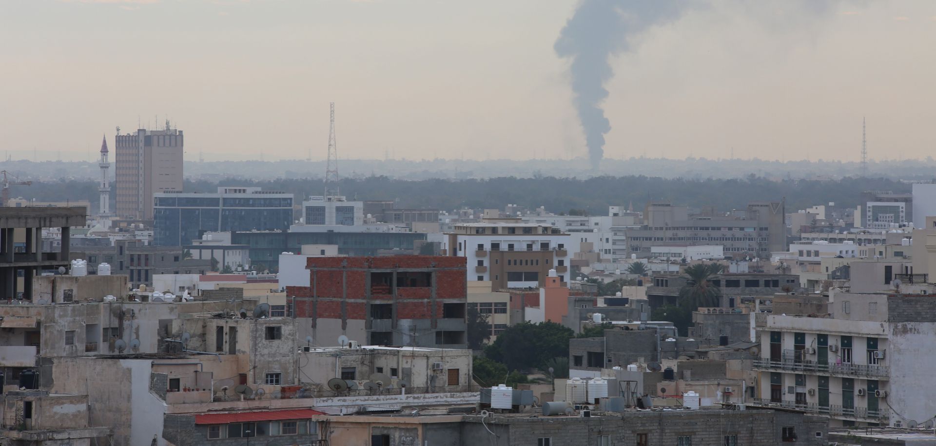 Smoke billows after an attack by Libyan National Army leader Khalifa Hifter on Tripoli on Jan. 19, 2019.