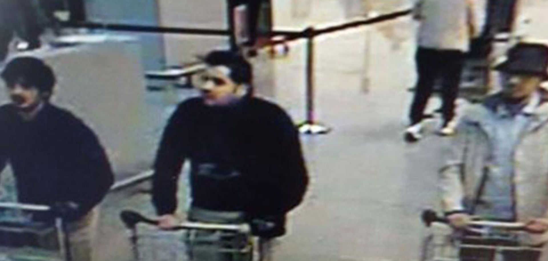A picture released on March 22, 2016 by the Belgian federal police on demand of the Federal prosecutor shows a screengrab of the airport CCTV camera showing three suspects of this morning's attacks at Brussels Airport, in Zaventem BELGIAN FEDERAL POLICE