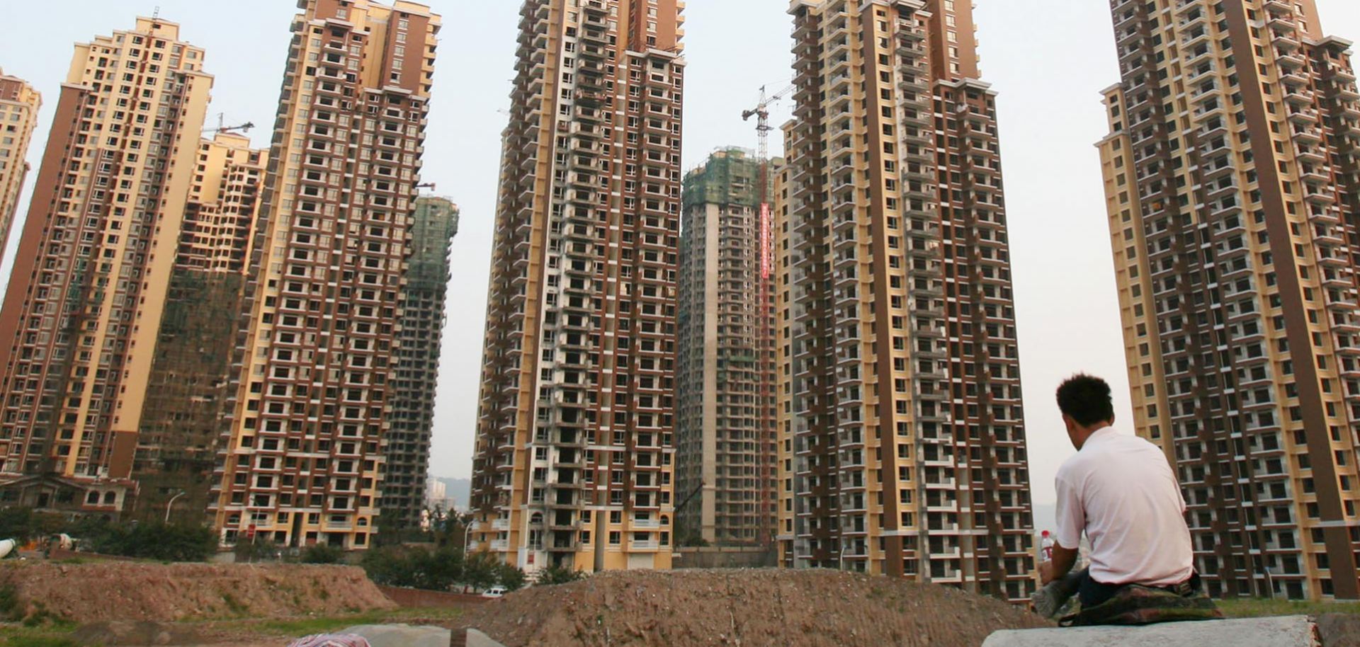 Buildings under construction near the People's Bank of China office building in Chongqing.