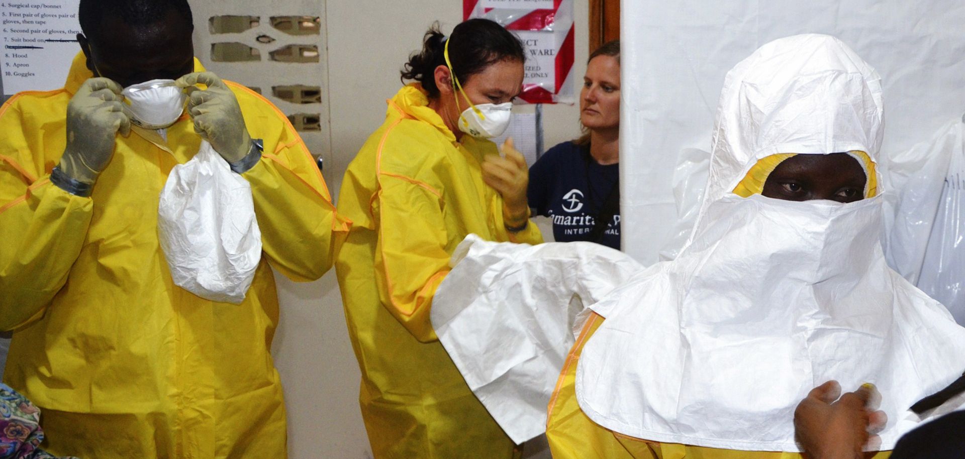 Staff of the Christian charity Samaritan's Purse dress in protective gear in the ELWA hospital in the Liberian capital Monrovia on July 24. 