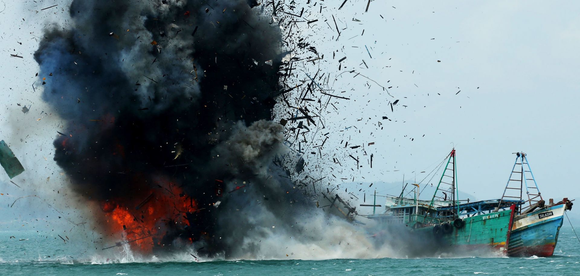 The Indonesian government blows up a foreign fishing vessel in its waters earlier this year.