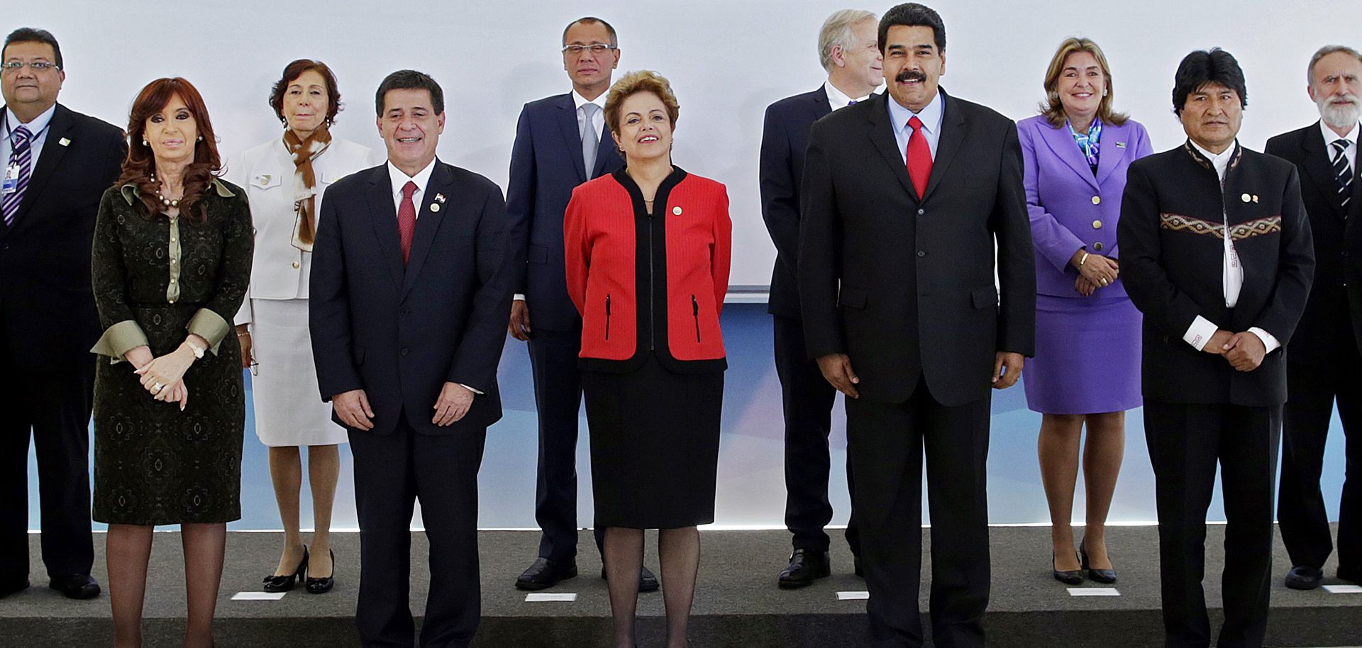 Latin American leaders, officials and diplomats from Brazil, Argentina, Uruguay, Paraguay and Venezuela pose for a photo during the Mercosur summit in Brasilia. The South American customs union will likely have to change to survive the region's economic slowdown.