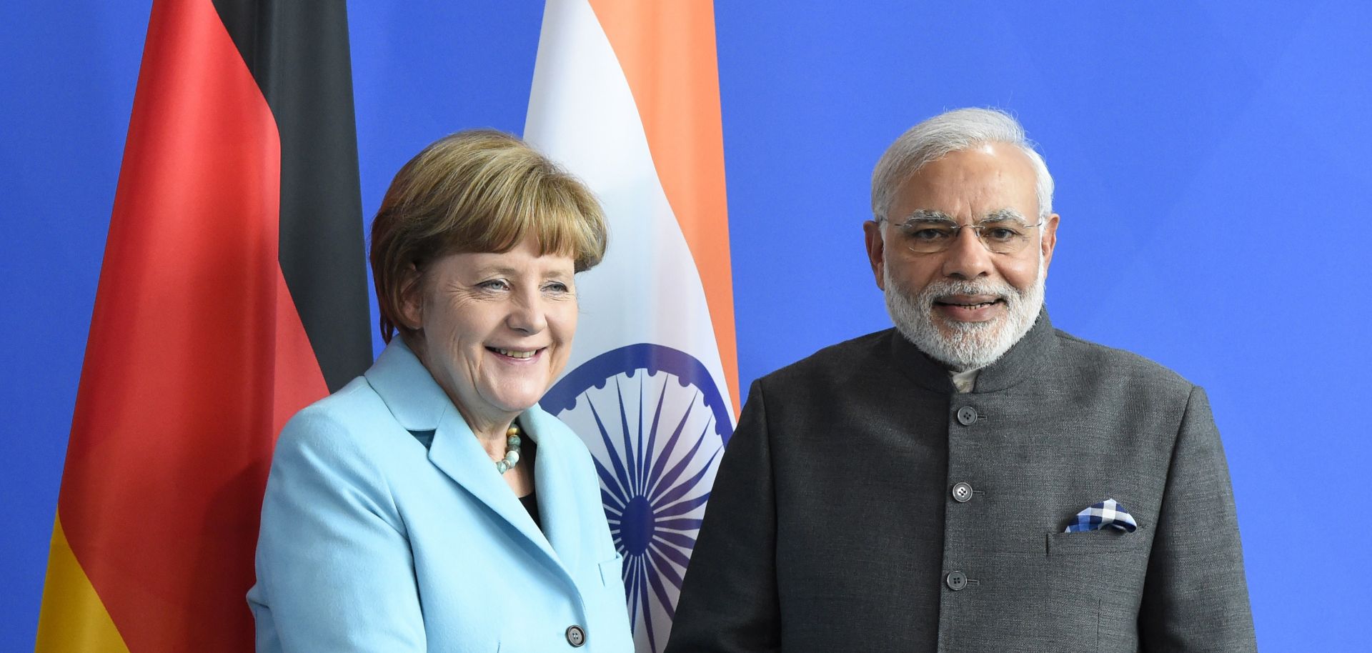 German Chancellor Angela Merkel (L) and Indian Prime Minister Narendra Modi shake hands after a conference in Berlin.