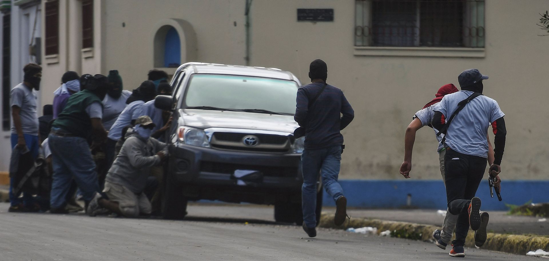 Paramilitaries surround the San Sebastian Basilica in Diriamba, Nicaragua, on July 9, 2018.