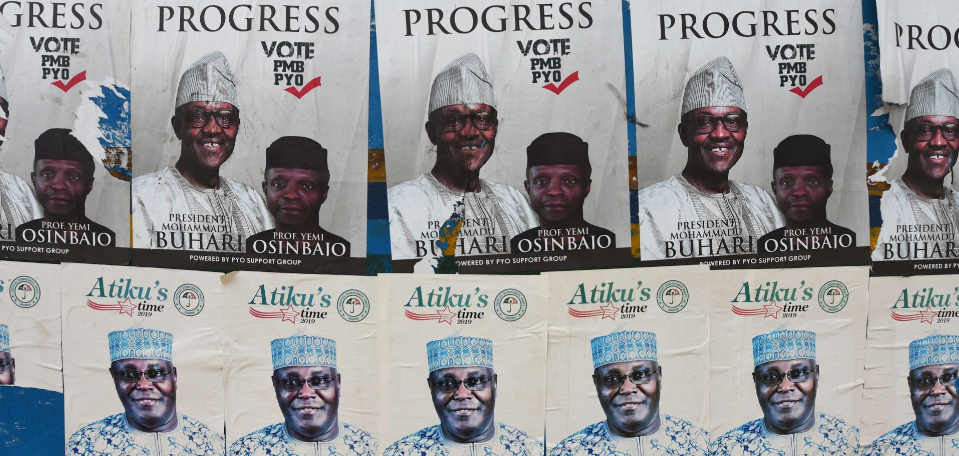 Side-by-side campaign posters line a bus stop for President Muhammad Buhari and his challenger, Atiku Abubakar, ahead of the presidential election on Feb. 16.