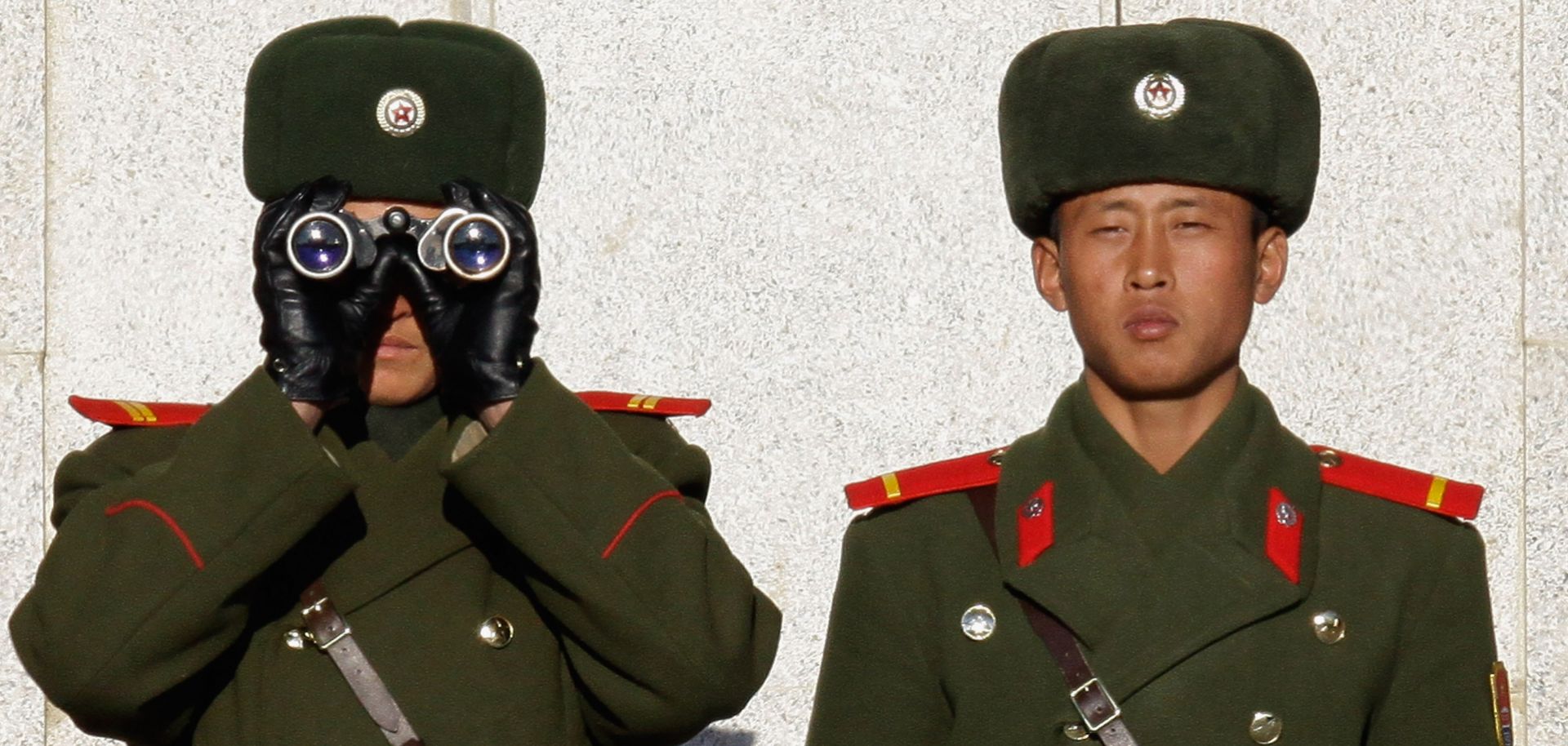 Soldiers in North Korea survey the South from across the Demilitarized Zone in late 2011.