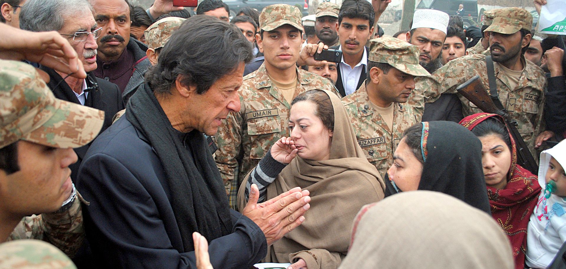 Pakistani Prime Minister Imran Khan meets with family members of schoolchildren killed in a 2014 massacre by Taliban militants in Peshawar.