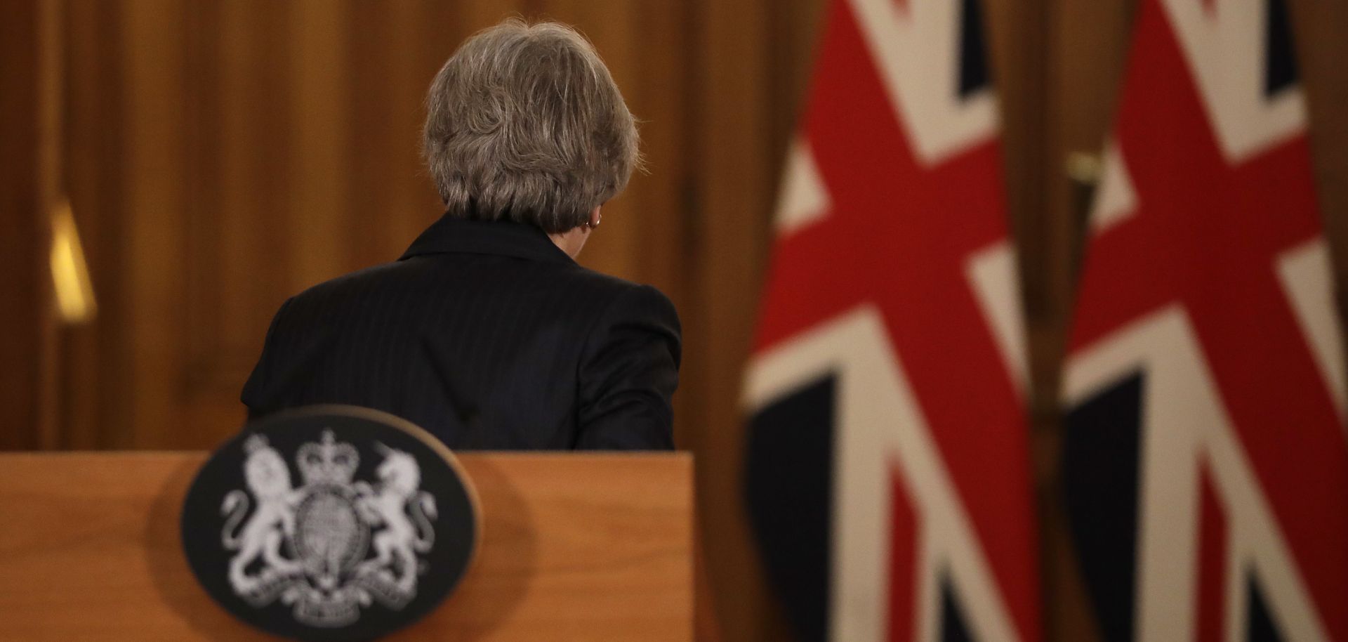 British Prime Minister Theresa May leaves after holding a news conference on Nov. 15, 2018, in London to discuss the United Kingdom's draft Brexit deal with the European Union.