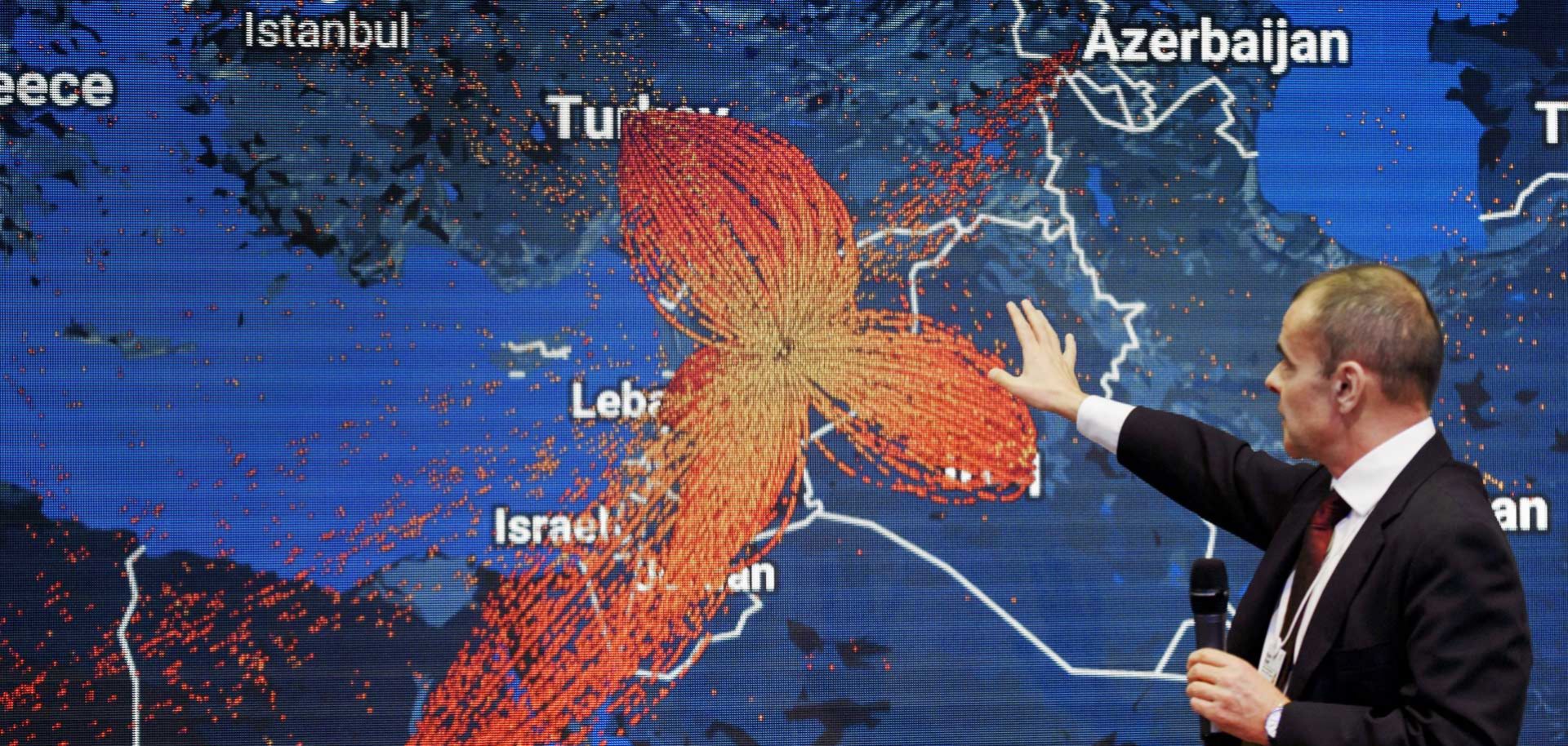 A map of Syrian refugee flows hangs at the World Economic Forum in Davos on Jan. 18. Throughout history, collective blame and punishment have forced people to flee their homes en masse in search of freedom and safety.