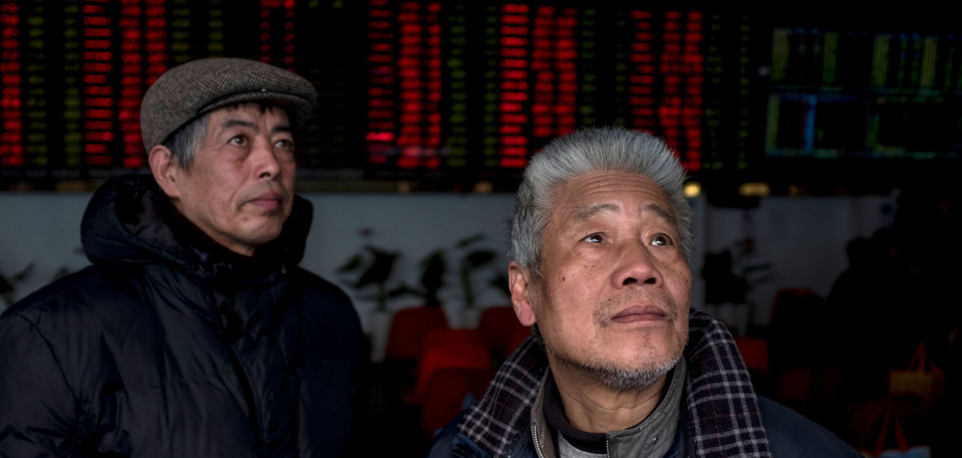 Investors monitor stock prices on computer screens at a brokerage house in Shanghai earlier this year.