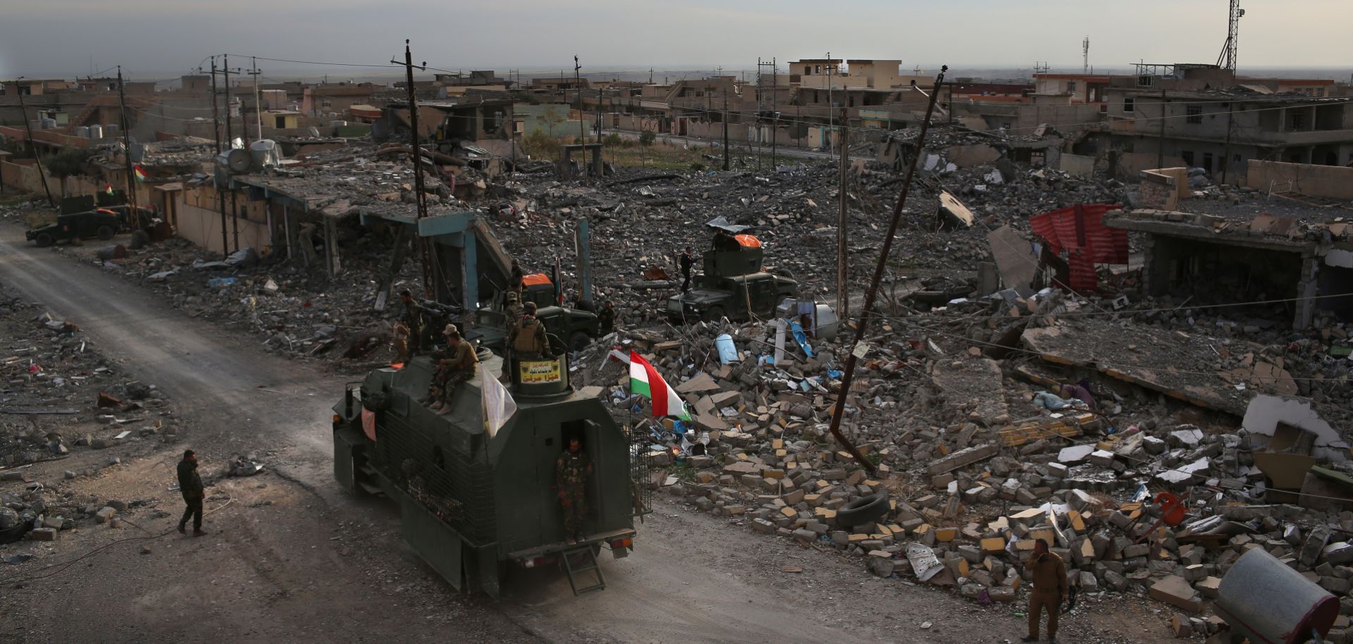 Fighters from the Kurdish peshmerga militias take up positions in Sinjar in November 2015, during the fight to oust the Islamic State from the area.