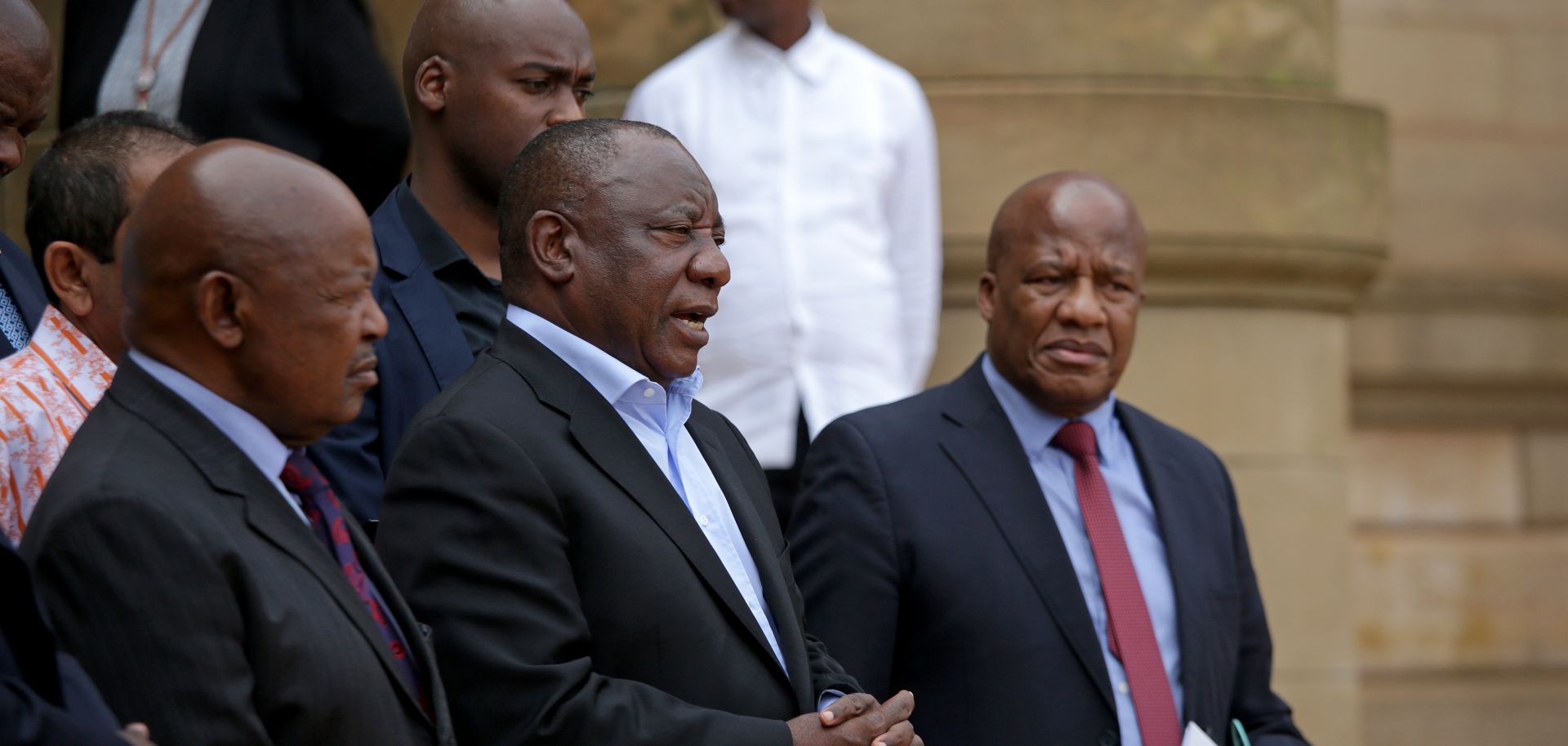 South African President Cyril Ramaphosa (center) addresses the media in Pretoria after concluding a meeting with various business and political leaders on matters relating to the COVID-19 outbreak on March 22, 2020.