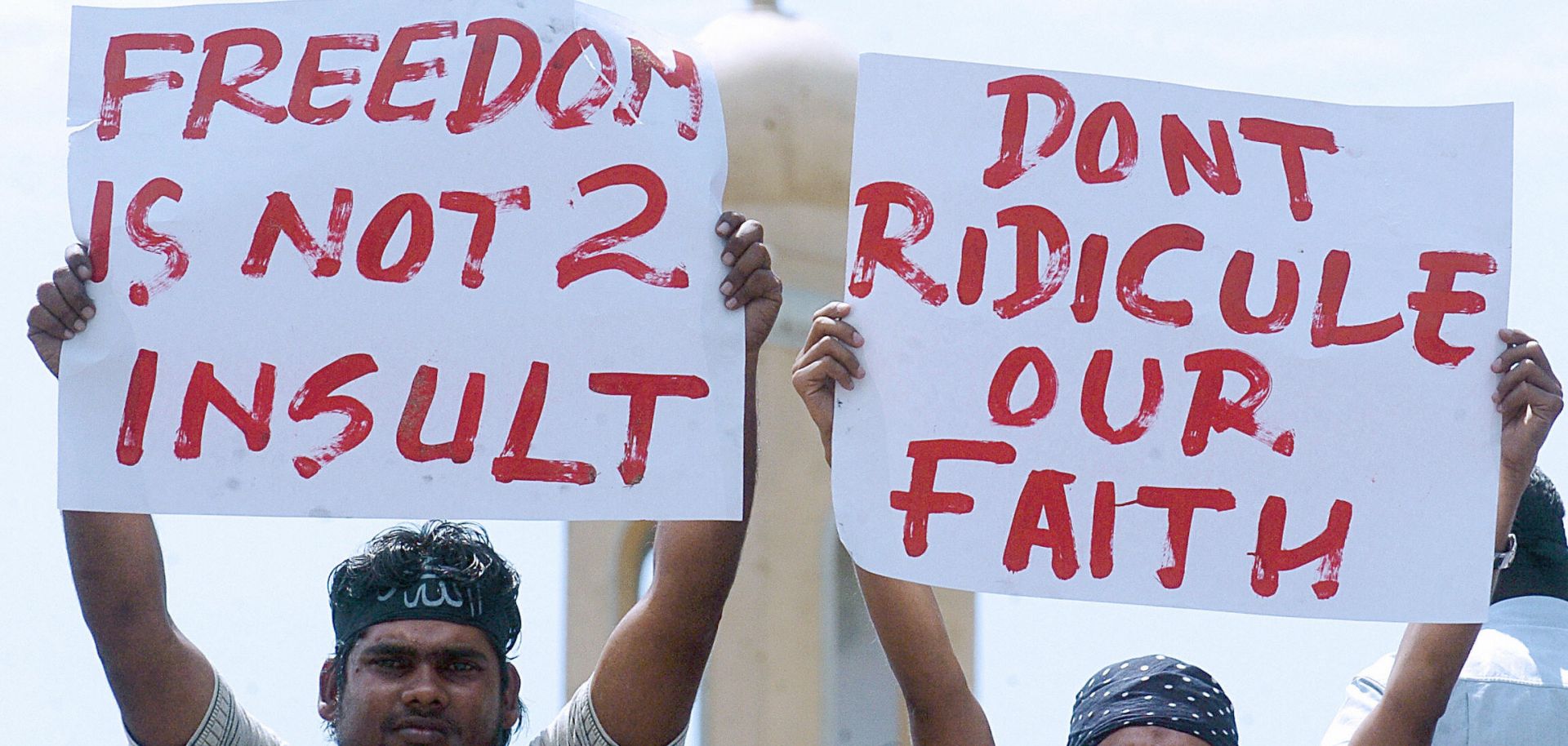 Sri Lankan Muslims pose with placards during a rally.