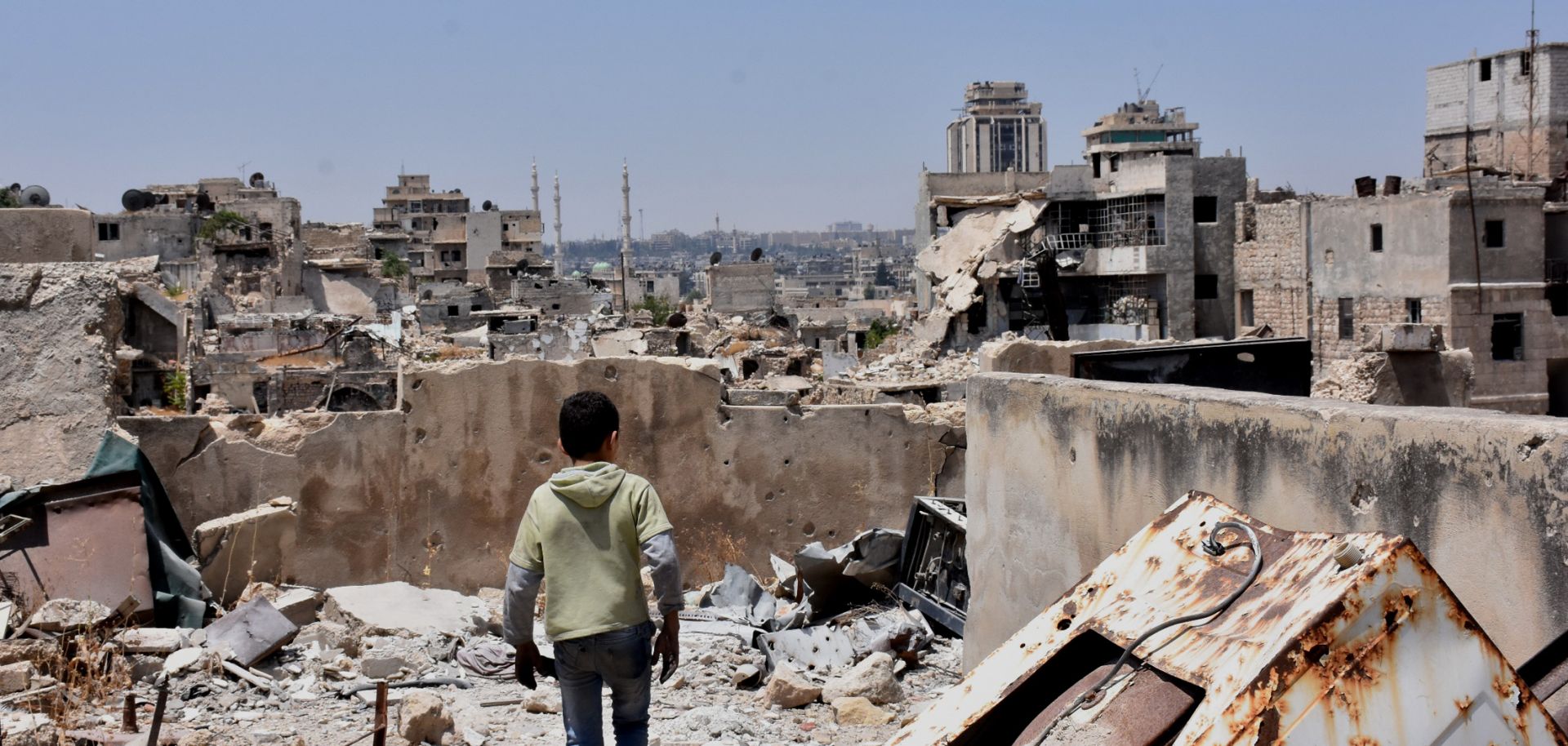 A boy walks amid the rubble in Aleppo, Syria.