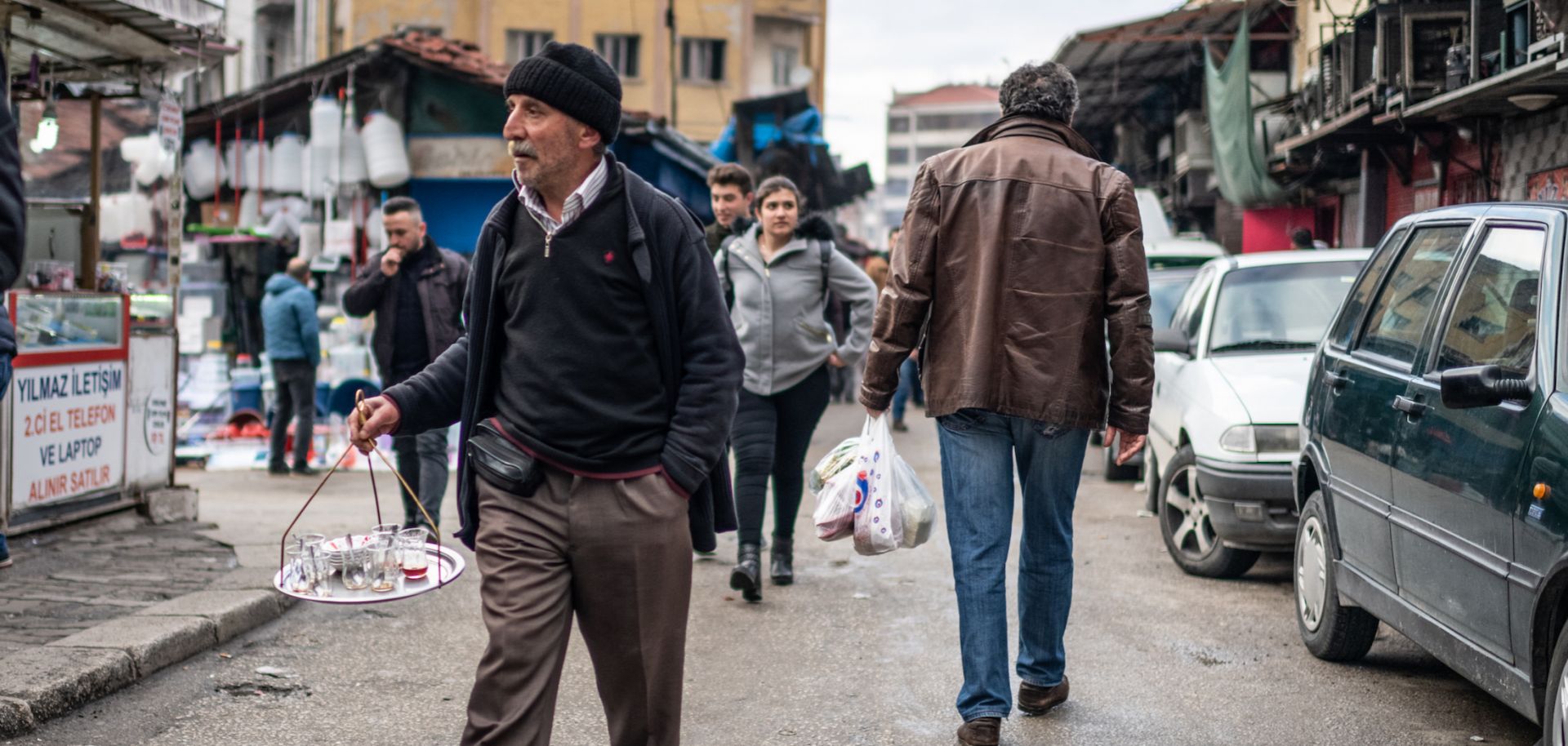 This photo shows a tea seller plying his wares in a shopping district of Ankara, Turkey.