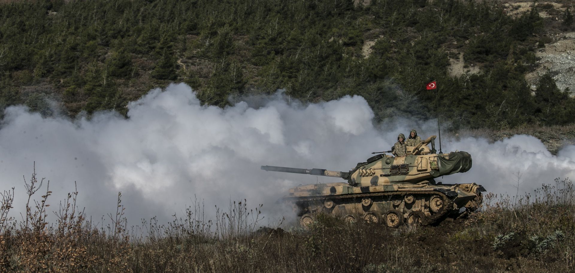 Turkish armored vehicles train near Idlib on the Turkish border with Syria.