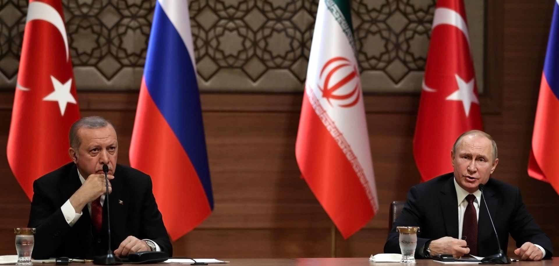 In this photograph, Presidents Recep Tayyip Erdogan (left) of Turkey and Vladimir Putin of Russia speak during a tripartite summit on Syria in April 2018.