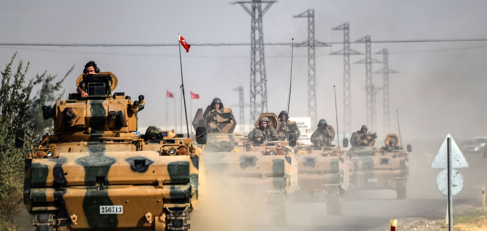 Turkish Army tanks driving to the Syrian Turkish border town of Jarabulus.
