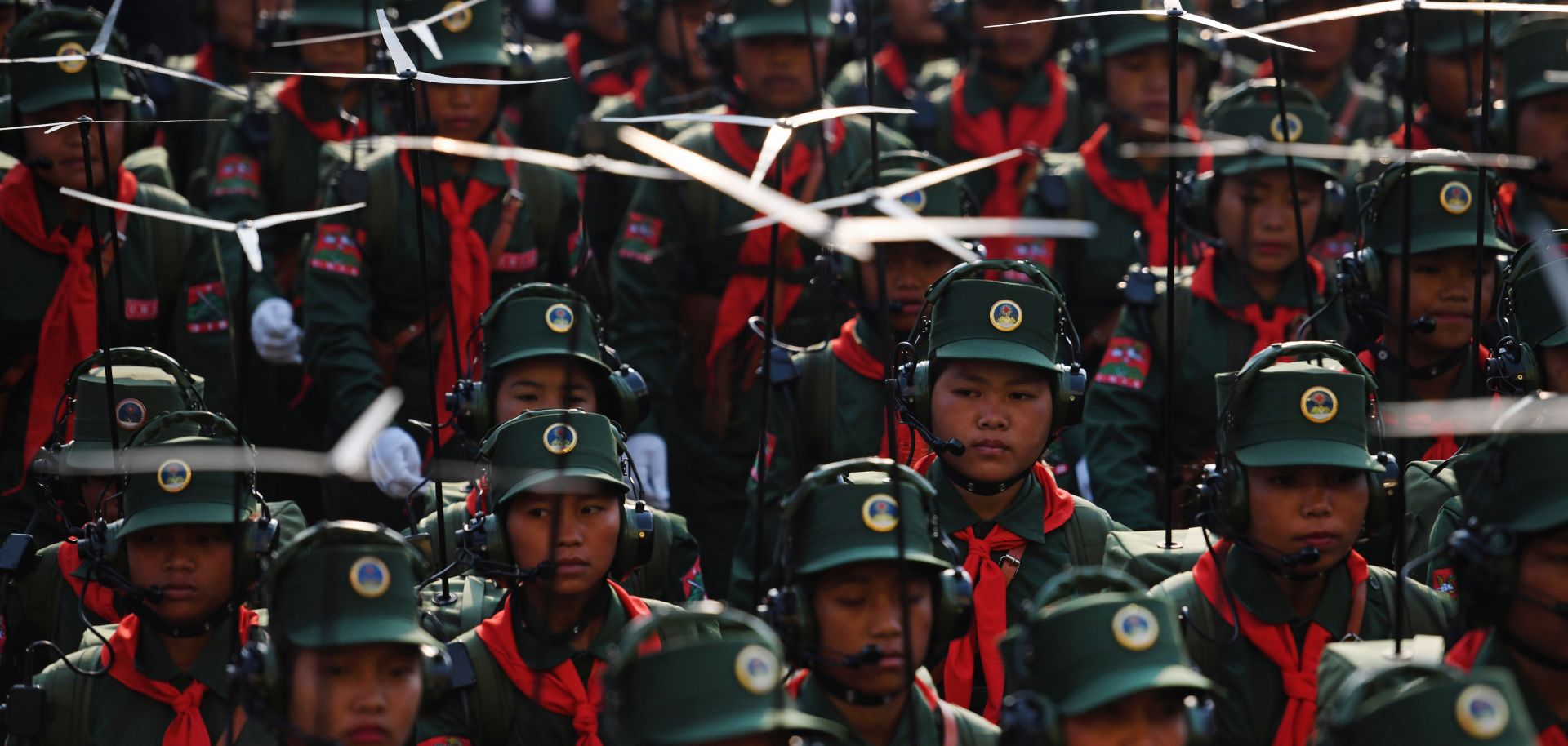 United Wa State Army soldiers participate in a military parade.