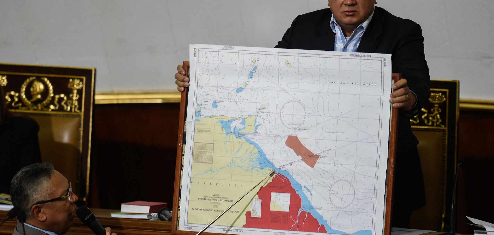 Venezuelan lawmaker Pedro Carreno (L) delivers a speech while Venezuelan deputy Diosdado Cabello (R) holds a map showing the border between Venezuela and Guyana during a legislative session in Caracas on Jan. 8, 2019.