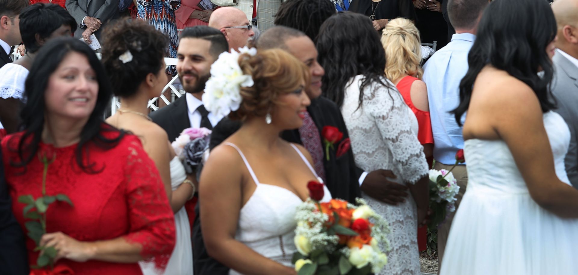 About 40 couples participate in a group Valentine's Day wedding ceremony on Feb. 14, 2017, in West Palm Beach, Florida.