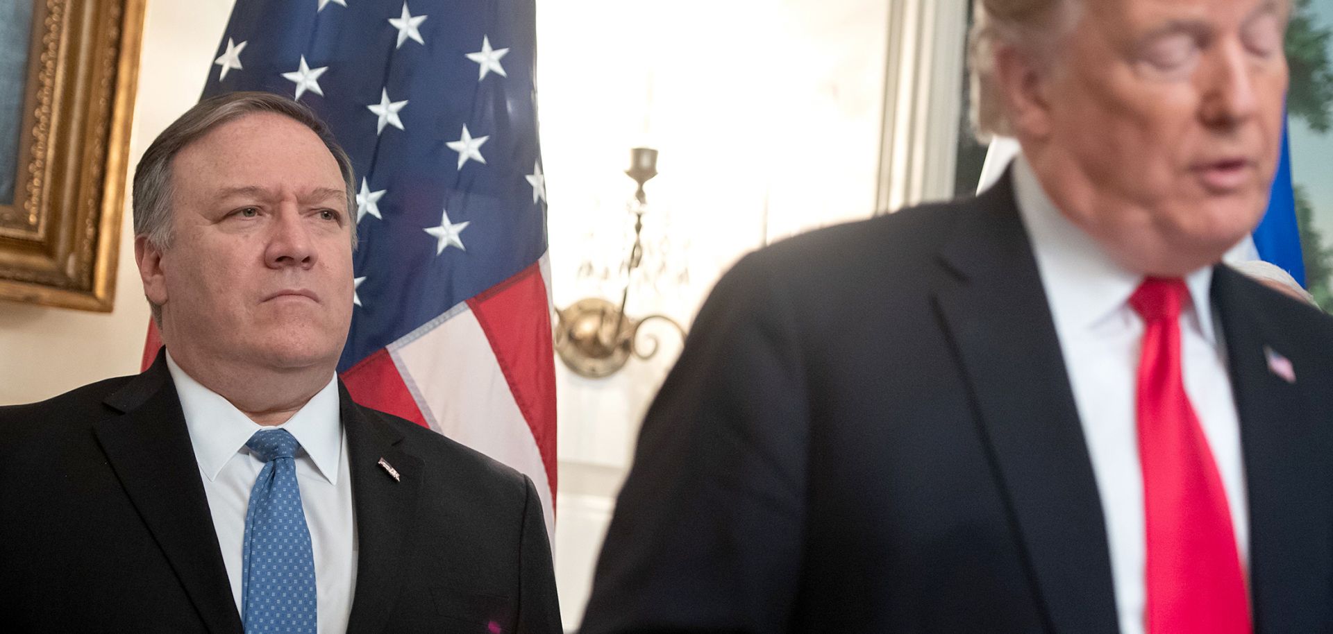 US President Donald Trump speaks alongside US Secretary of State Mike Pompeo (L) prior to signing a Proclamation on the Golan Heights in the Diplomatic Reception Room at the White House in Washington, DC, March 25, 2019, during a visit by Israeli Prime Minister Benjamin Netanyahu. 