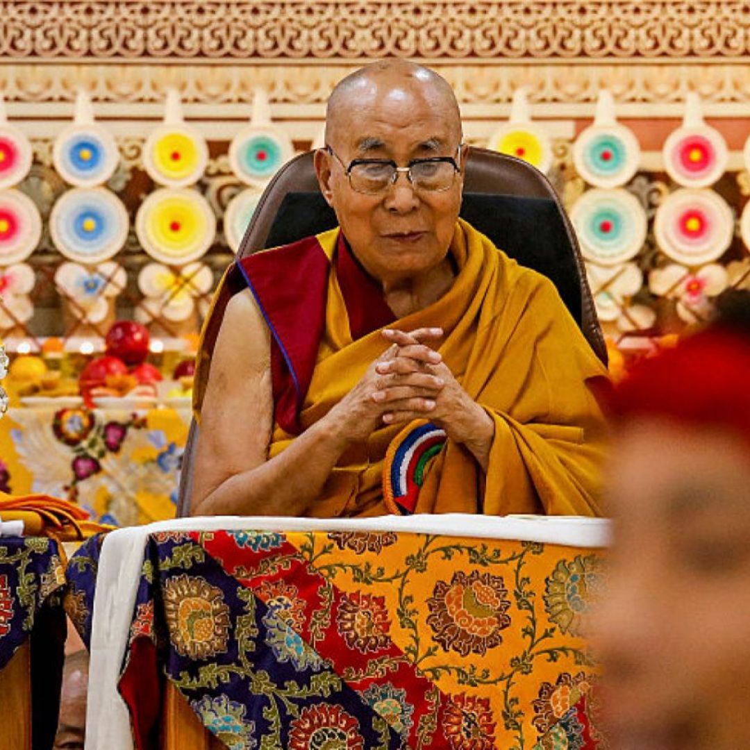 Tibetan spiritual leader the Dalai Lama looks on as offerings presented by Buddhist followers are laid on a table during a Long Life Prayer offering ceremony at the Main Tibetan Temple in McLeod Ganj, near the Indian city of Dharamshala, on June 30, 2025. Tibetan spiritual leader the Dalai Lama looks on as offerings presented by Buddhist followers are laid on a table during a Long Life Prayer offering ceremony at the Main Tibetan Temple in McLeod Ganj, near the Indian city of Dharamshala, on June 30, 2025.