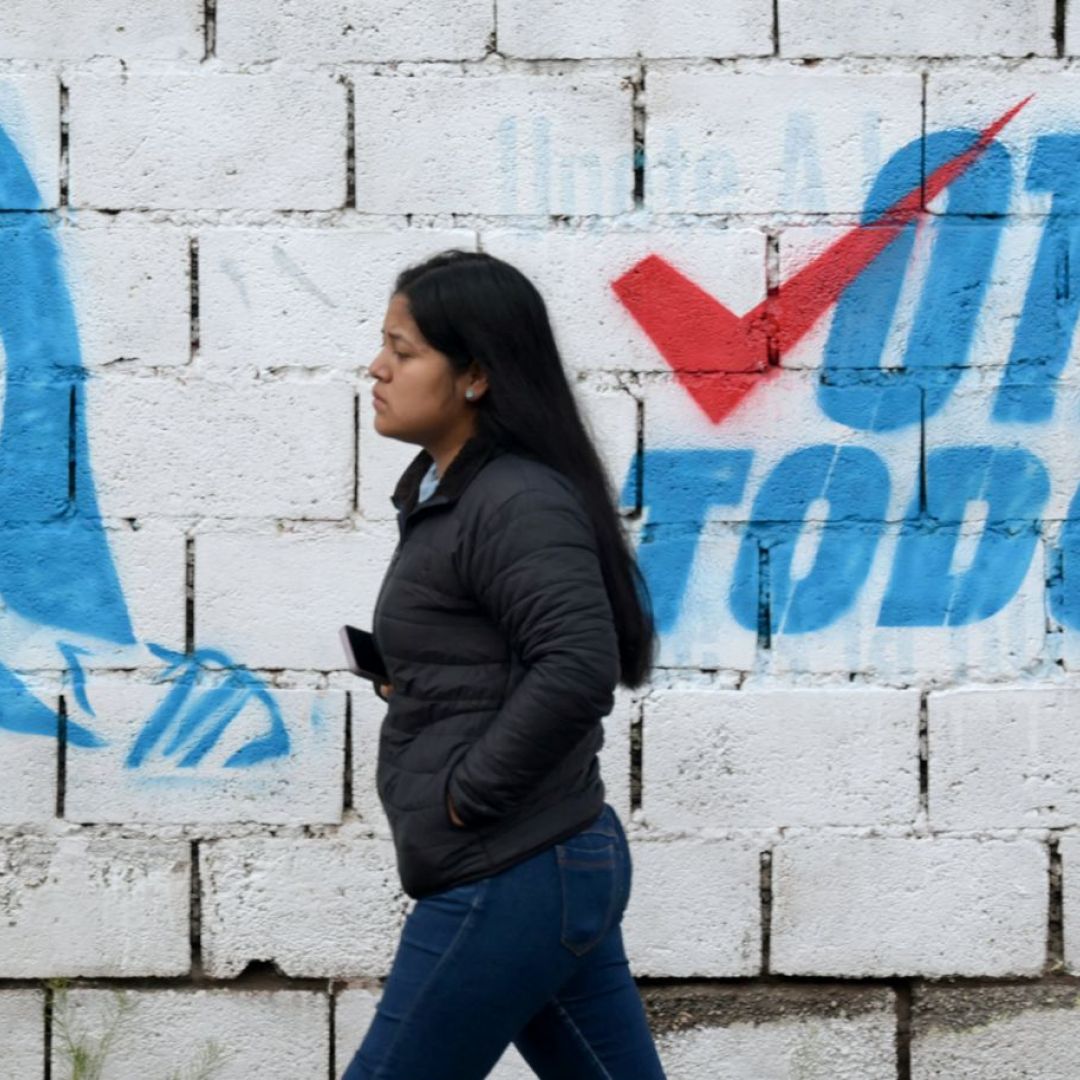 A woman walks past a mural of leftist presidential candidate Luisa Gonzalez in Quito, Ecuador, on Feb. 5, 2025. A woman walks past a mural of leftist presidential candidate Luisa Gonzalez in Quito, Ecuador, on Feb. 5, 2025.