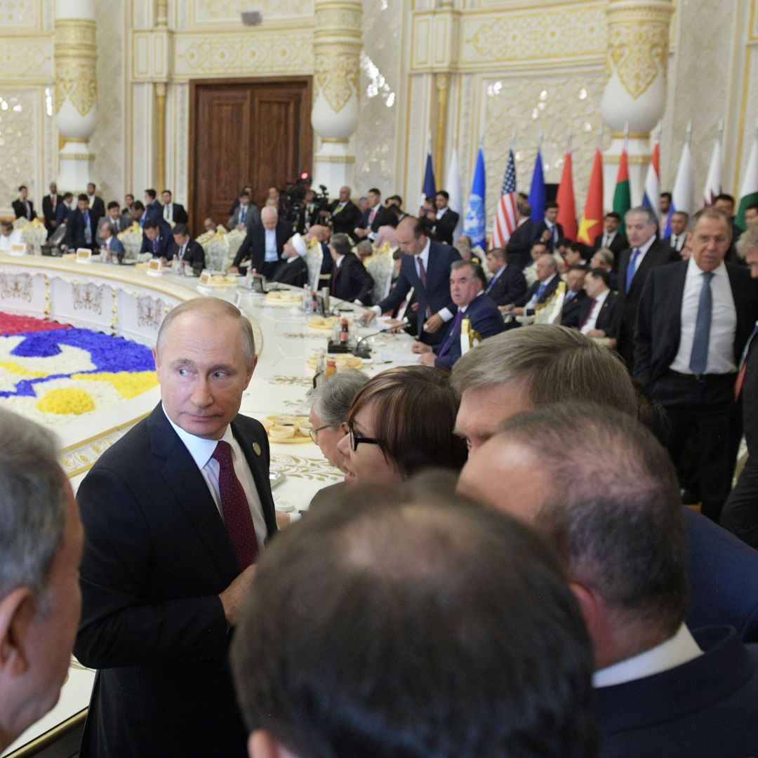 Russian President Vladimir Putin (center) listens to his Turkish counterpart Recep Tayyip Erdogan (left) at the 2019 Conference on Interaction and Confidence-Building Measures in Asia (CICA) in Dushanbe, Tajikistan. 