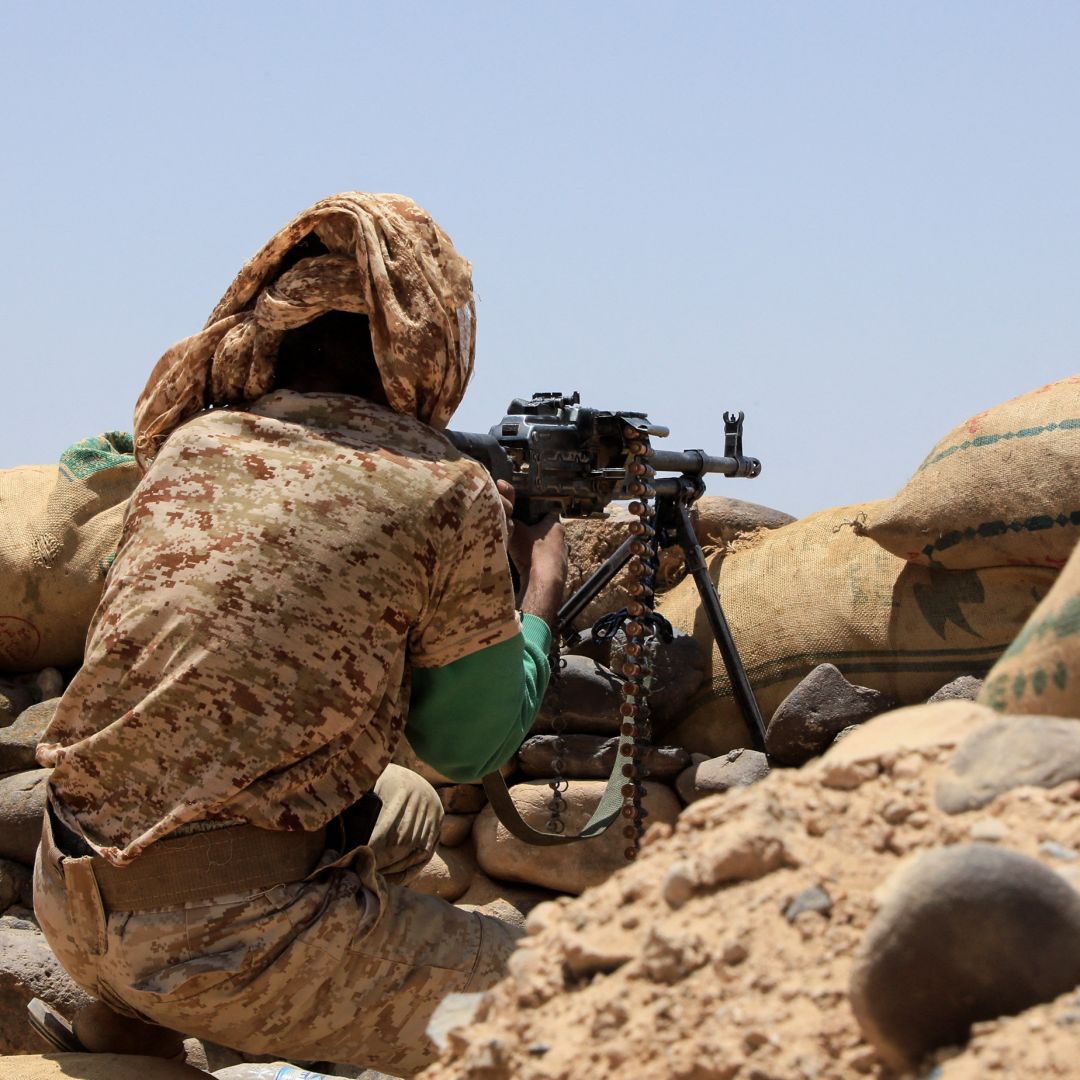 A fighter with forces loyal to Yemen's Saudi-backed government holds a position against Iran-backed Houthi rebels in the northeastern province of Marib on April 6, 2021. A fighter with forces loyal to Yemen's Saudi-backed government holds a position against Iran-backed Houthi rebels in the northeastern province of Marib on April 6, 2021.