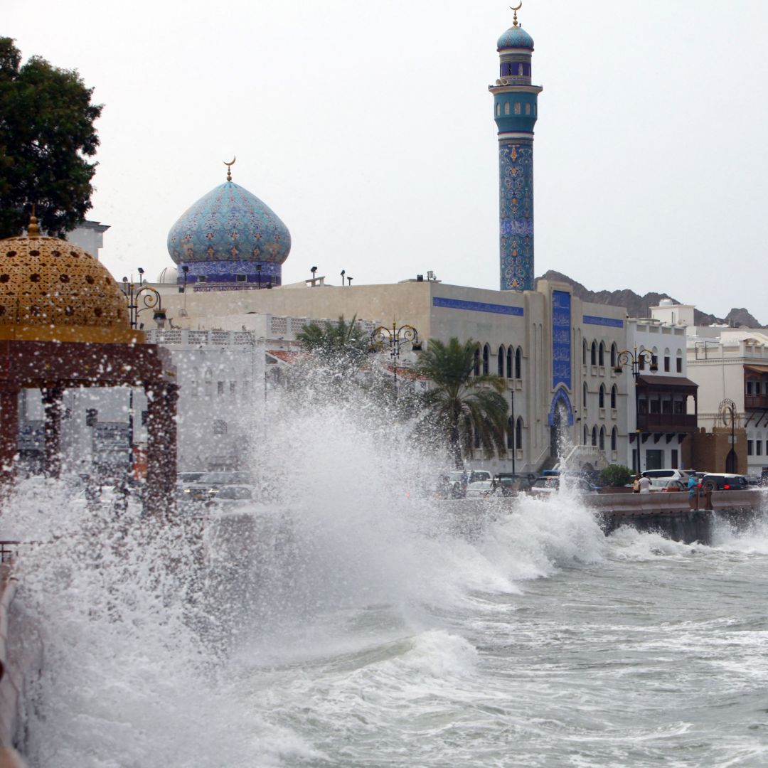 High waves break on the seaside promenade in Muscat on Oct. 2, 2021, the day before Cyclone Shaheen officially made landfall in Oman. 