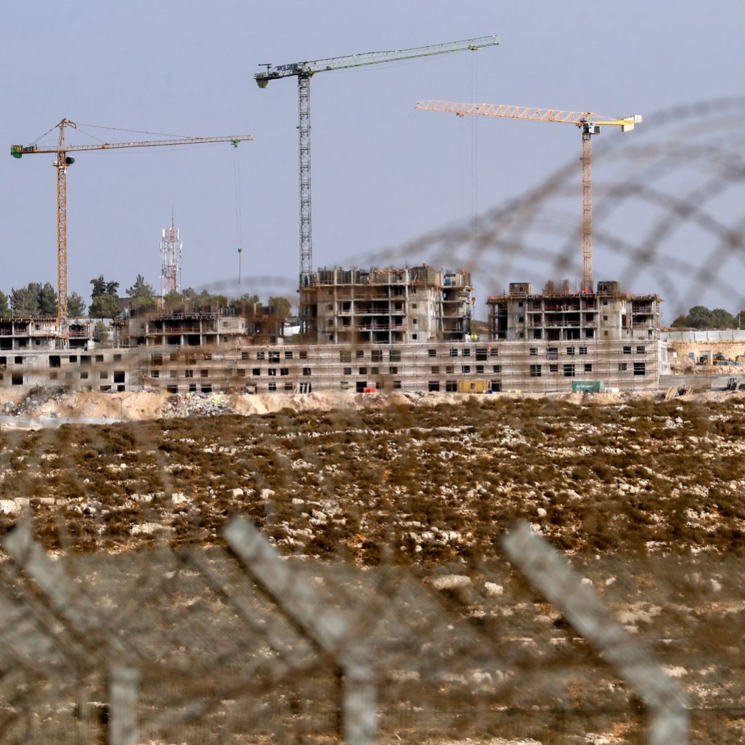 A photo taken on Oct. 28, 2021, shows ongoing construction work in an Israeli settlement near the Palestinian city of Ramallah in the West Bank. A photo taken on Oct. 28, 2021, shows ongoing construction work in an Israeli settlement near the Palestinian city of Ramallah in the West Bank.