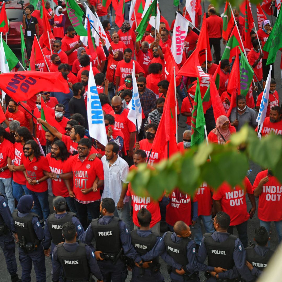 Police stand guard in Male, the Maldives, as protesters take part in an anti-India rally organized by the island nation's opposition coalition on March 25, 2022. Police stand guard in Male, the Maldives, as protesters take part in an anti-India rally organized by the island nation's opposition coalition on March 25, 2022.