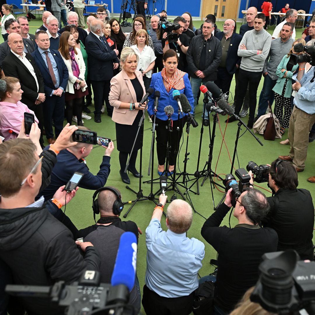 Michelle O'Neill (center, left) and Mary Lou McDonald -- the vice president and president, respectively, of the Irish political party Sinn Fein -- speak to reporters on May 07, 2022, after the results of Northern Ireland's legislative election were announced.