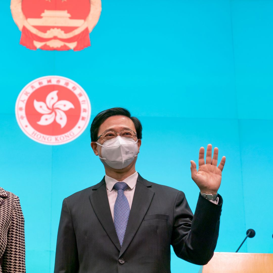 Hong Kong Chief Executive-elect John Lee (right) and current Chief Executive Carrie Lam attend a press conference at the Central Government Complex on May 9, 2022, in Hong Kong, China. 