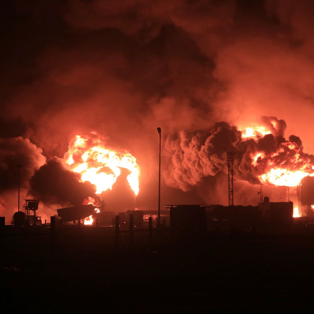 A giant fire erupts at an oil storage facility following Israeli strikes in Yemen's Houthi-held port city of Hodeida on July 20, 2024. 