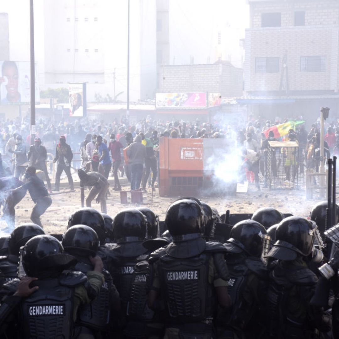 Protesters fight gendarmes on March 5, 2021, near their barracks in the Colobane neighborhood in Dakar, Senegal, during clashes following the arrest of the main opposition leader, Ousmane Sonko. 