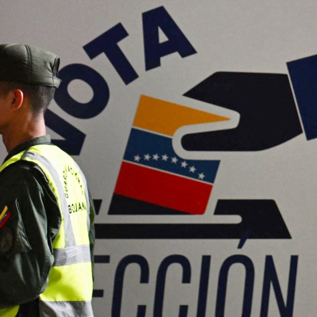 A member of Venezuela’s national guard walks past the information center of the country’s National Electoral Council (CNE) in Caracas on July 16, 2024, ahead of the upcoming presidential election.