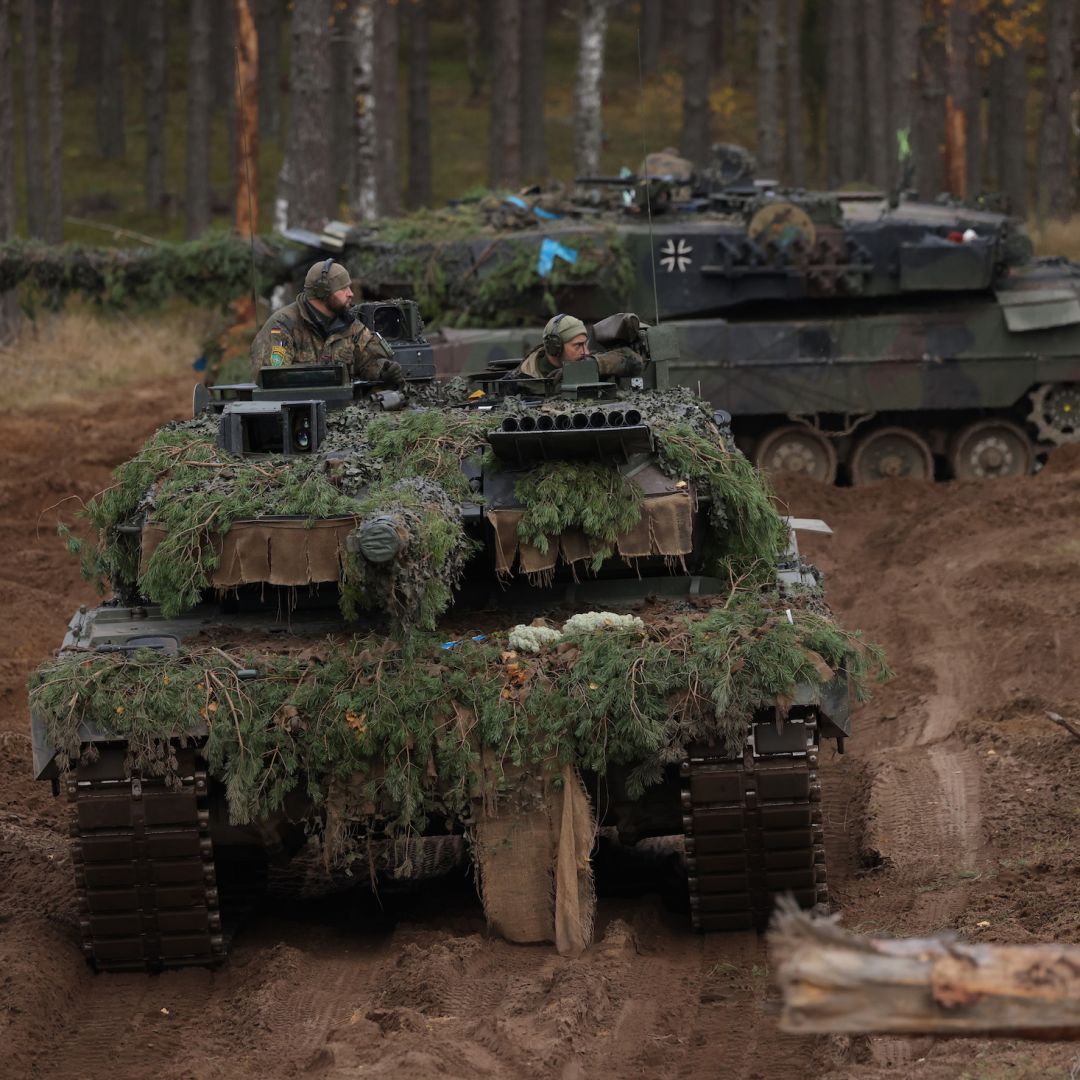 Two Leopard 2A6 main battle tanks of the German armed forces participate in the NATO Iron Wolf military exercises on Oct. 27, 2022, in Pabrade, Lithuania. 