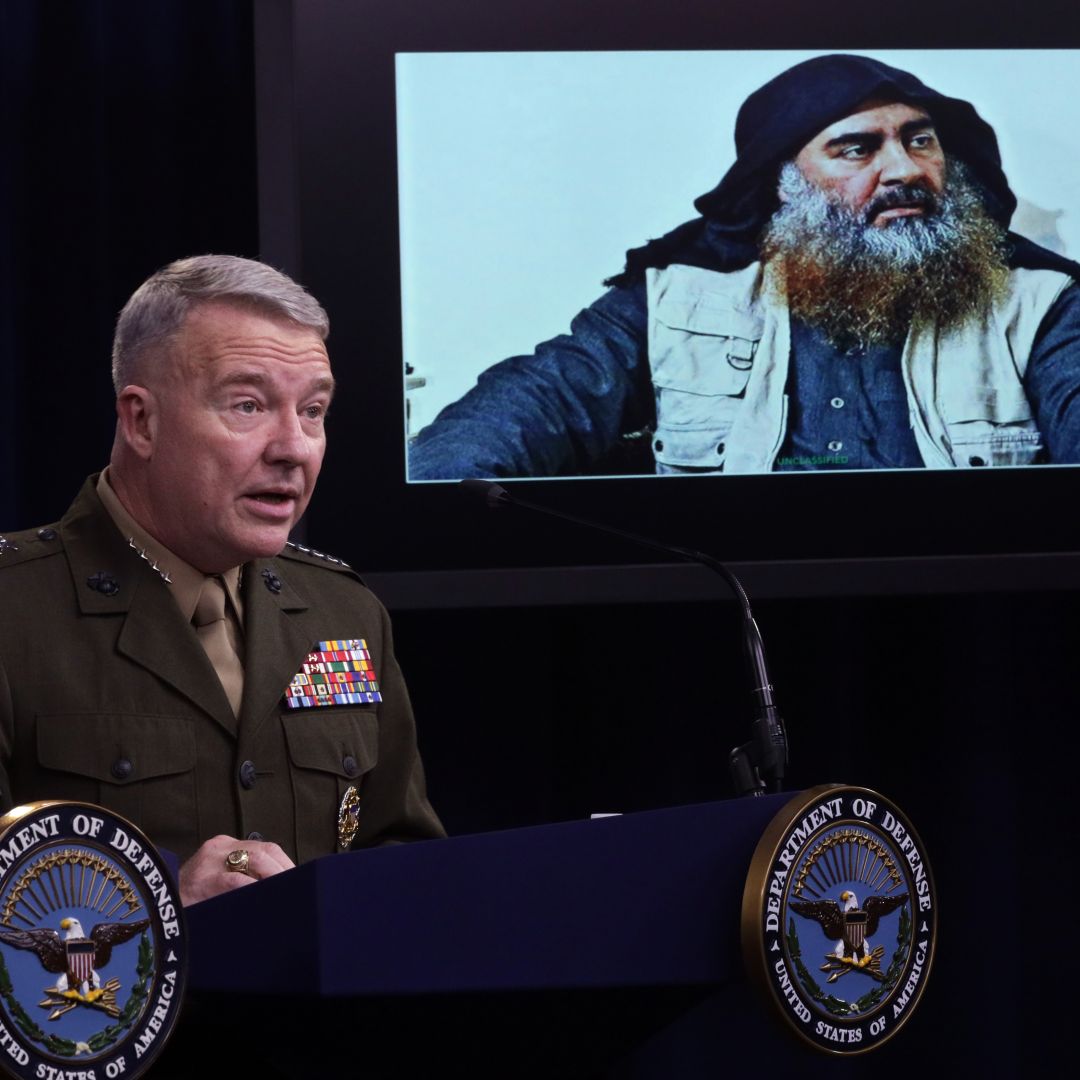 U.S. Marine Corps Gen. Kenneth McKenzie speaks as a picture of Abu Bakr al-Baghdadi is seen during a press briefing Oct. 30, 2019, at the Pentagon in Arlington, Virginia.