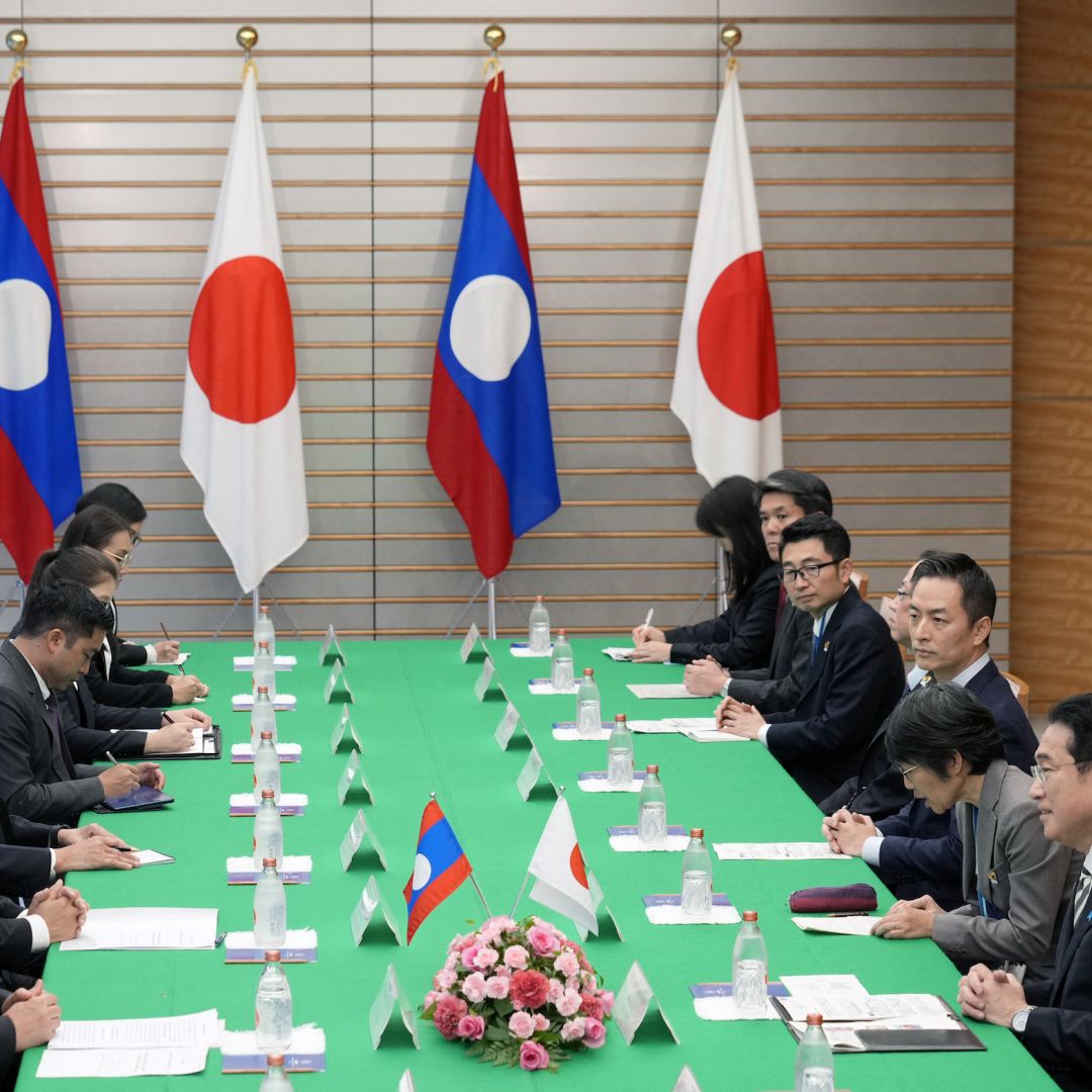 Japan's Prime Minister Fumio Kishida (R) delivers an opening address at the start of a bilateral meeting with Laos' Prime Minister Sonexay Siphandone (L) at the prime minister's official residence in Tokyo, Japan, on Dec. 16, 2023.