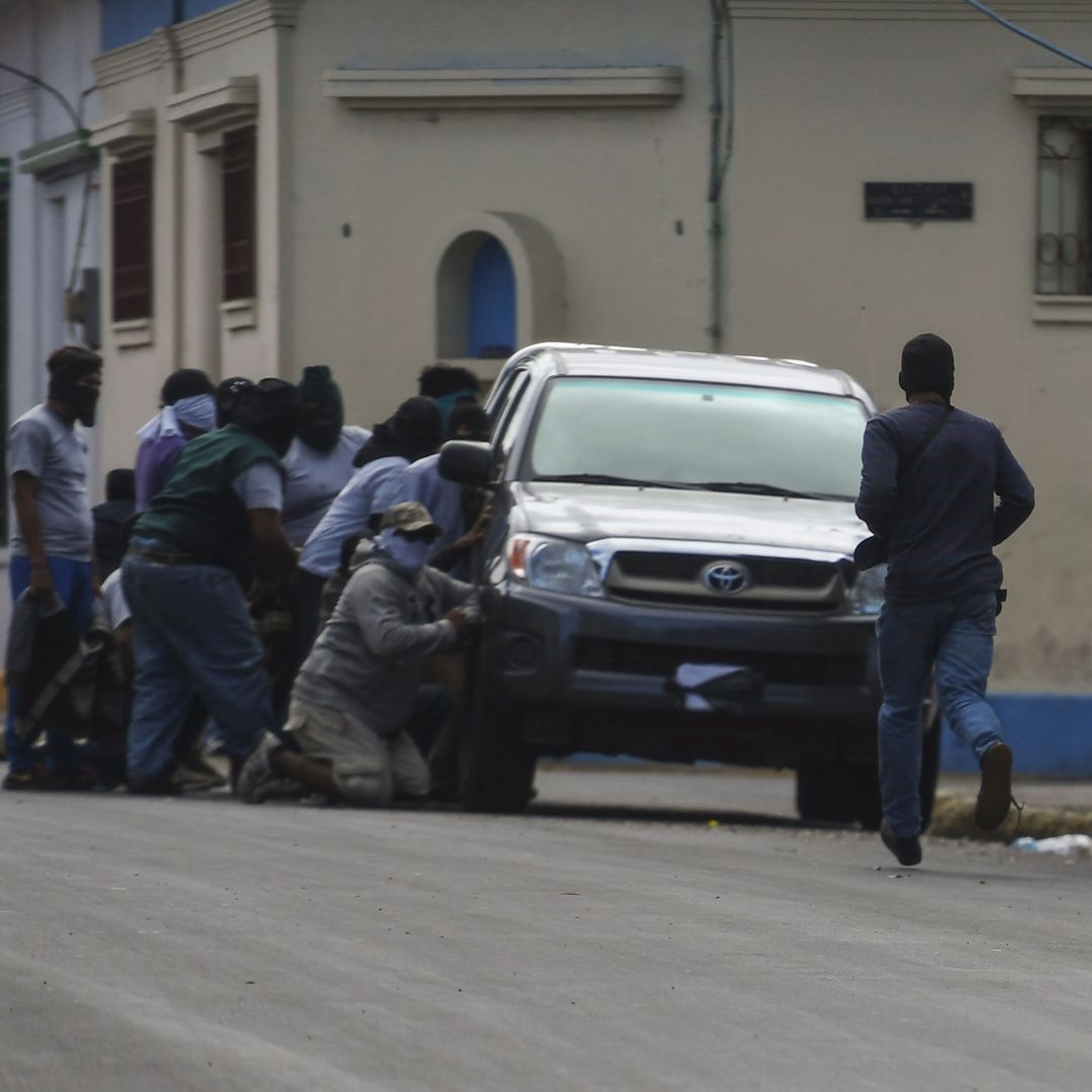 Paramilitaries surround the San Sebastian Basilica in Diriamba, Nicaragua, on July 9, 2018.