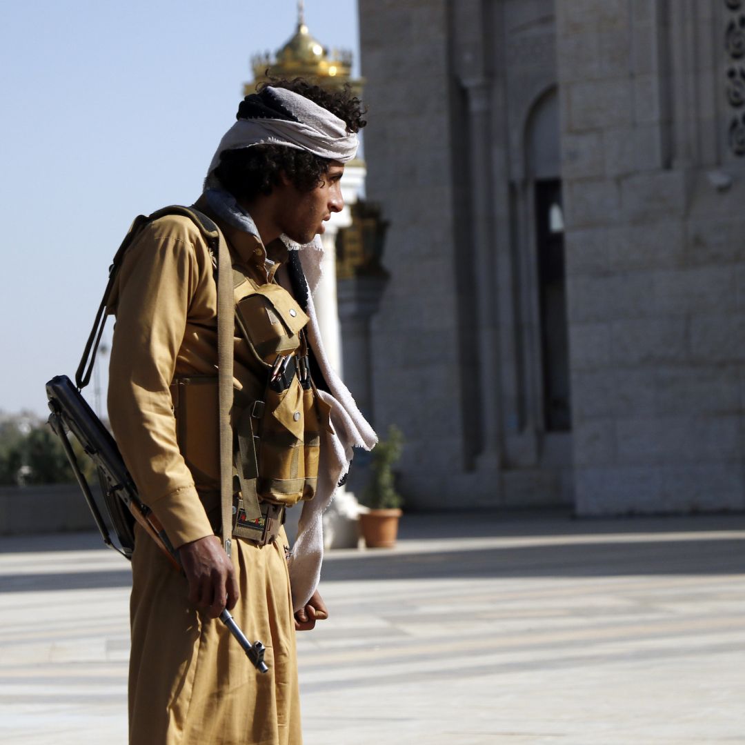 A Houthi fighter stands outside at a funeral for rebels killed in Marib, Yemen, on Feb. 28, 2021. 